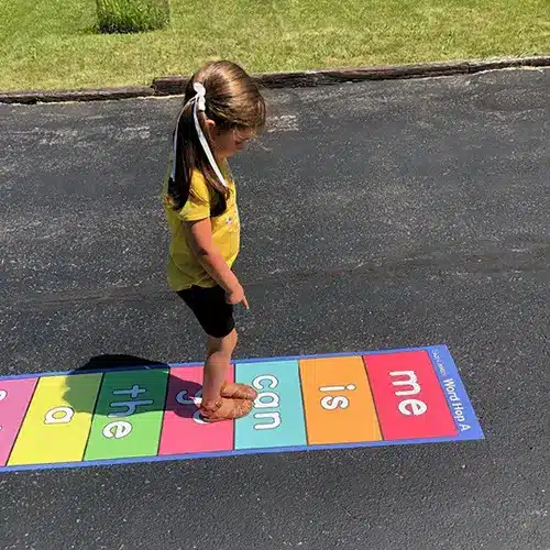 Student using Word Hop A outdoor sticker
